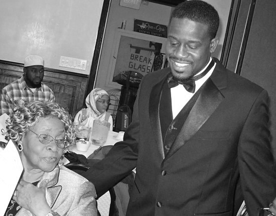 Shafiq Abdussabur with his grandmother after being sworn in as president of the National Association of Black Law Enforcement Officers. Photo by Allan Appel.