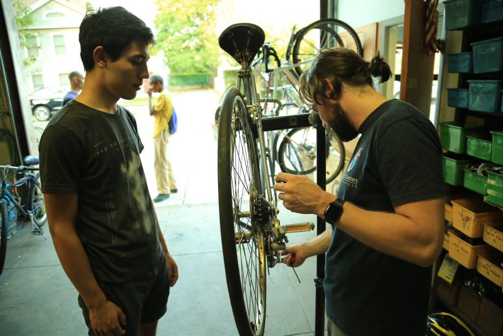Repairing a bike at the Co-op. (Credit to William Reid)