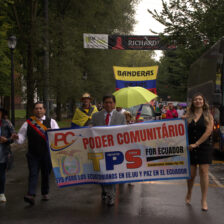 Angélica Idrovo (right) and Carlos Córdova (middle) lead the Ecuadorian parade on the New Haven Green.